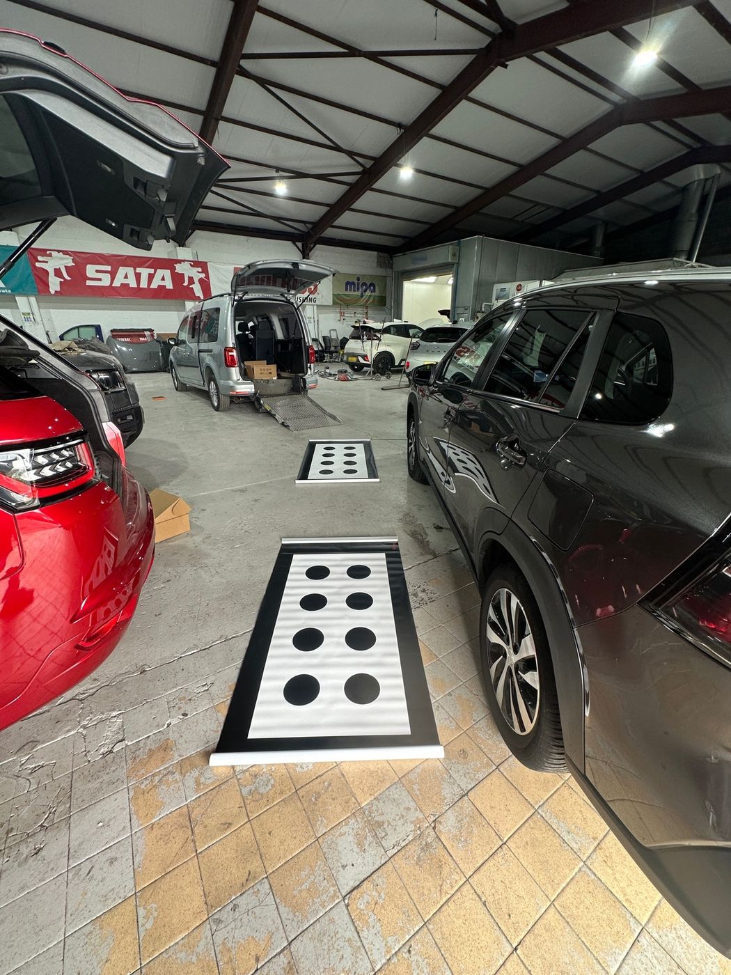 Camera calibration targets laid out beside the car in Sheffield