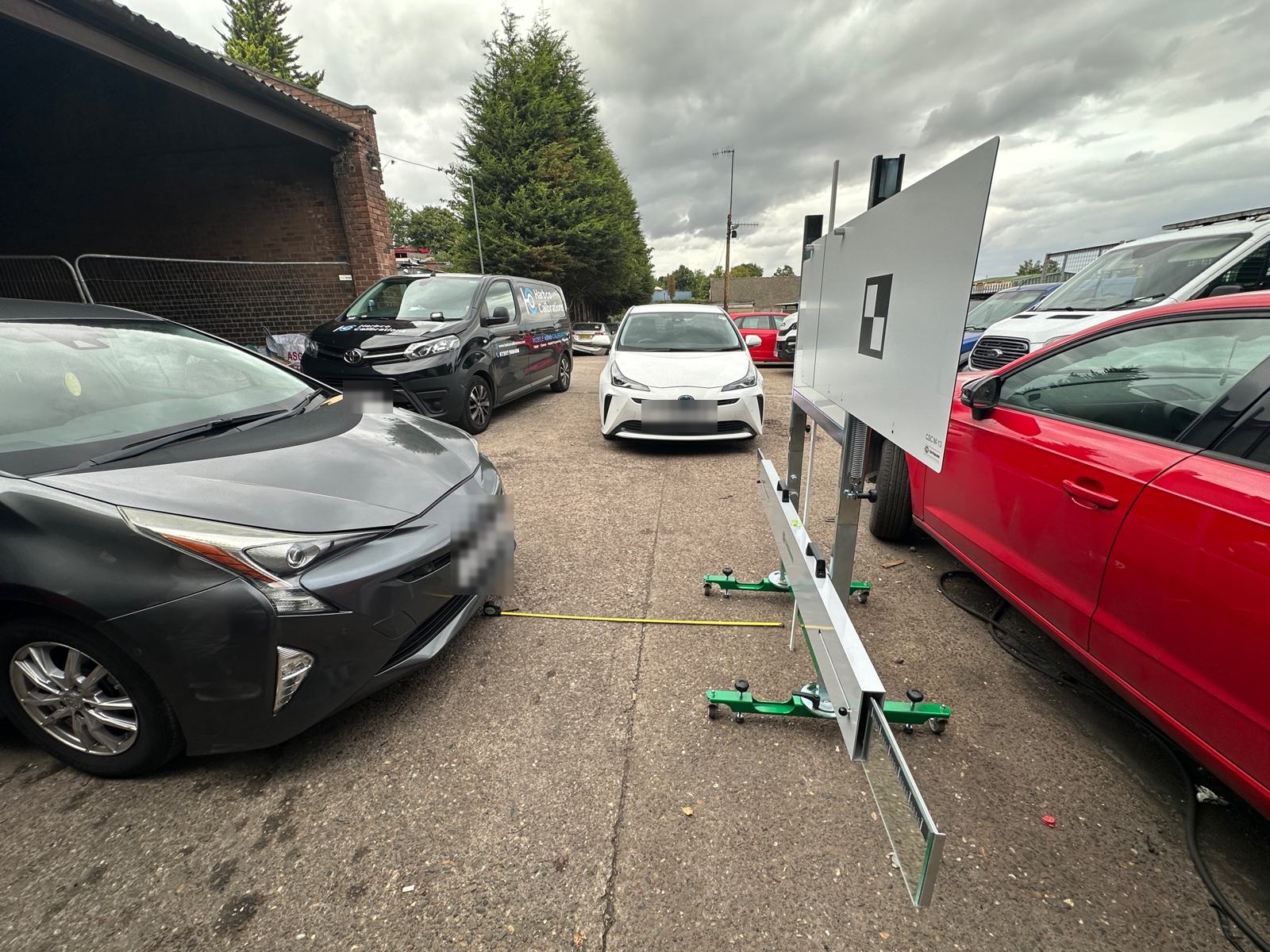 Toyota Prius in a yard lined up with a camera calibration target in Rotherham