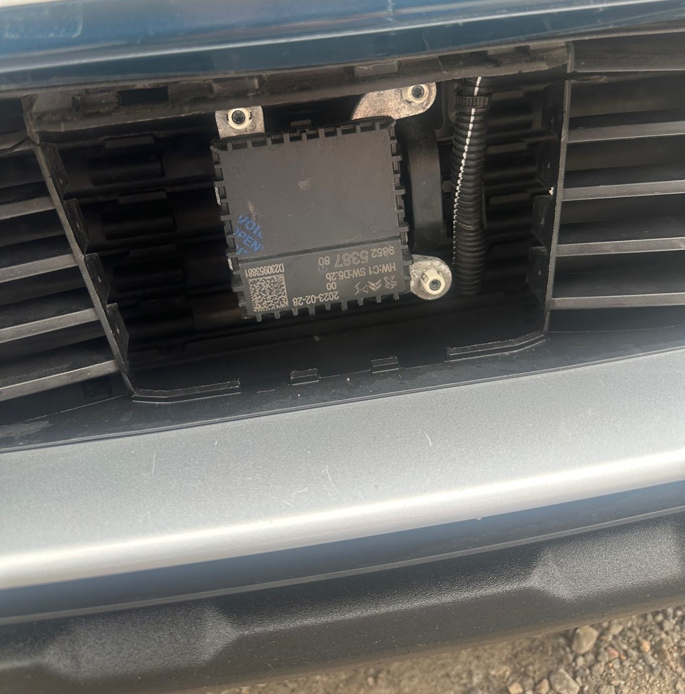 On a job in Heanor: the front radar sensor behind the grille, which controls adaptive cruise and emergency braking